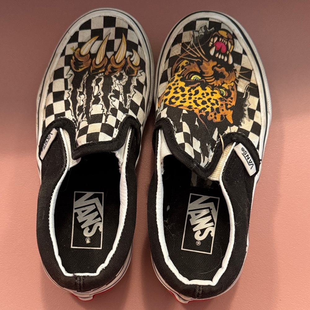Vans Black and White Checkered Slip-Ons with Leopard Graphic